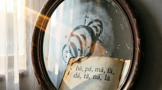 Mirror reflecting blurred book page with phonetic symbols in warm morning light with clear breath condensation patterns revealing shapes (AI-generated illustration)