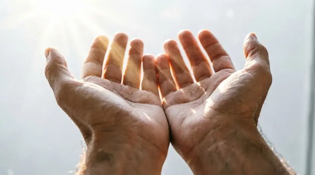 open hands with light falling through, soft morning light (AI-generated illustration)