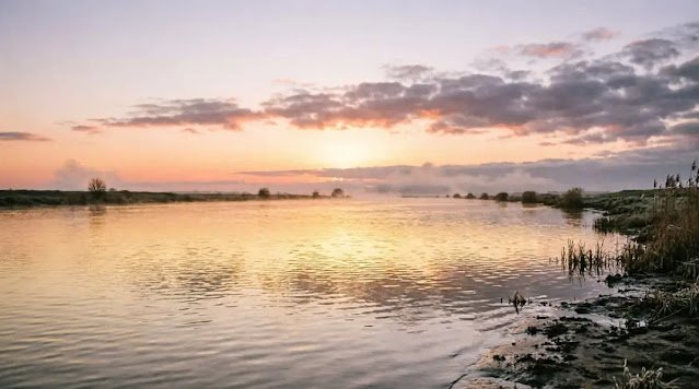 Wide river with sunrise and open water(AI-generated illustration)