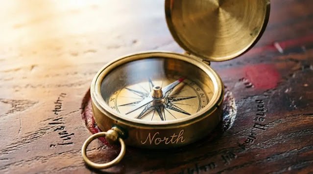 Brass compass wooden table pointing north handwritten word direction (AI-generated illustration)
