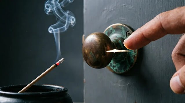 Smoke forming spiral, finger approaching doorknob, tiny gap casting shadow (AI-generated illustration)